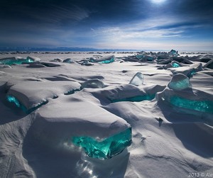 Turquoise Ice Splintering Through the Surface